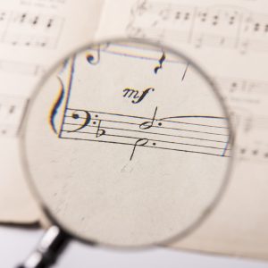 View through a magnifying glass of the notes in a music score